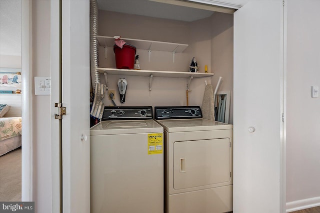 39770 E Sun Dr Unit 125, Fenwick Island, DE 19944 - laundry room featuring washer and clothes dryer and attic access