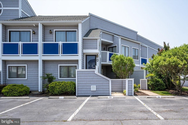 39770 E Sun Dr Unit 125, Fenwick Island, DE 19944 - view of building exterior with uncovered parking