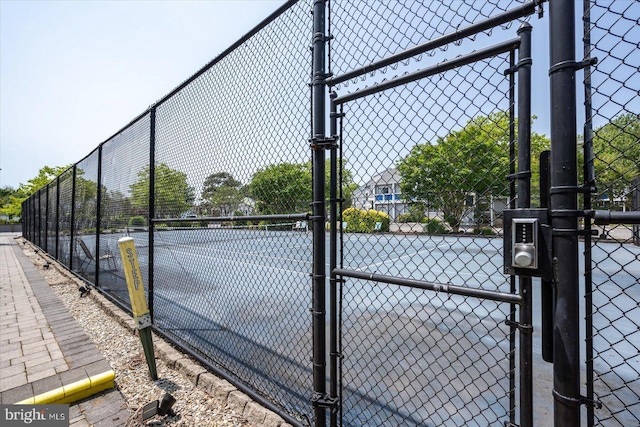 39770 E Sun Dr Unit 125, Fenwick Island, DE 19944 - view of tennis court with a gate