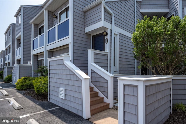 39770 E Sun Dr Unit 125, Fenwick Island, DE 19944 - view of building exterior featuring uncovered parking and stairway
