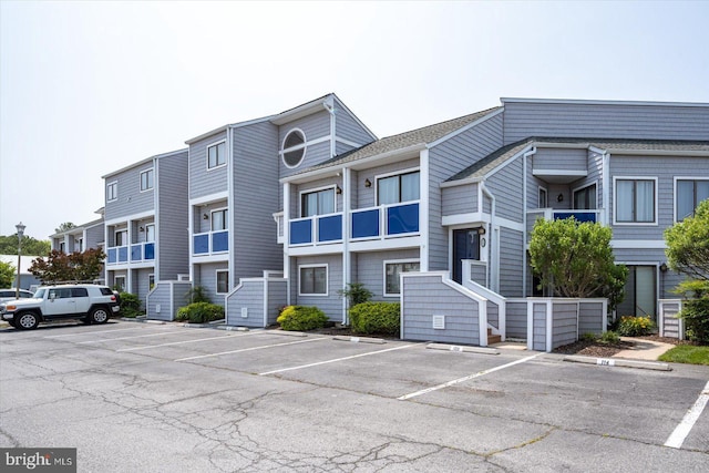 39770 E Sun Dr Unit 125, Fenwick Island, DE 19944 - view of building exterior with uncovered parking