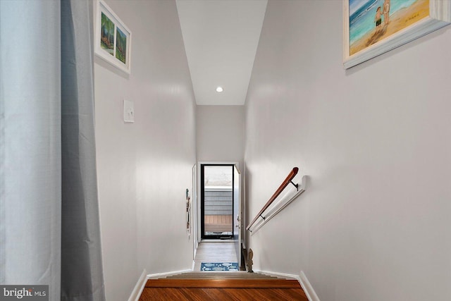 39770 E Sun Dr Unit 125, Fenwick Island, DE 19944 - stairway with wood finished floors and recessed lighting