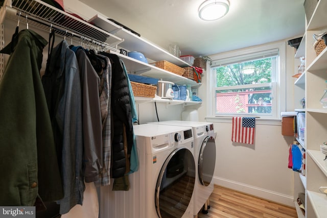 5021 23rd Rd N, Arlington, VA 22207 - laundry area featuring separate washer and dryer, light wood-style floors, and baseboards