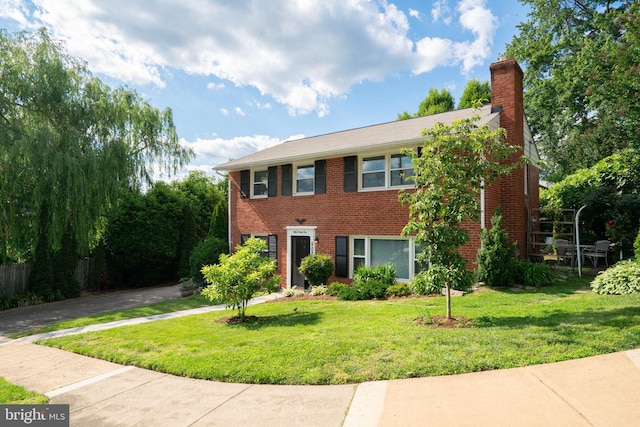 5021 23rd Rd N, Arlington, VA 22207 - view of front of property with a front yard, a chimney, and brick siding