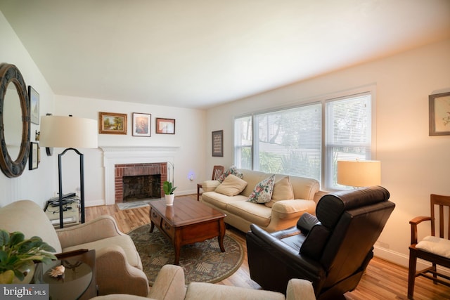 5021 23rd Rd N, Arlington, VA 22207 - living area featuring wood finished floors, a brick fireplace, and baseboards
