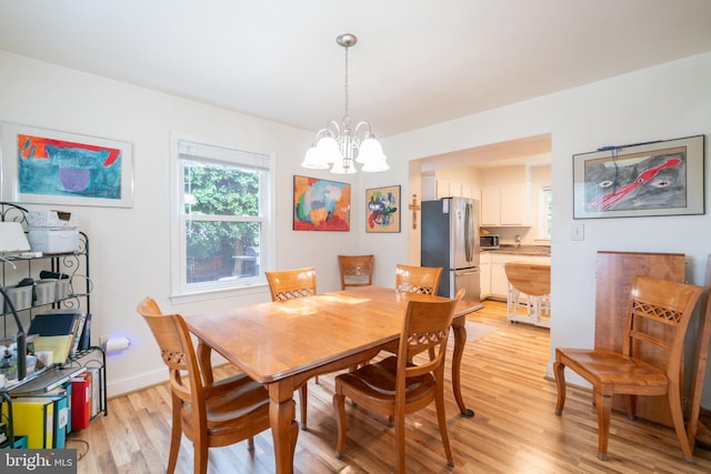 5021 23rd Rd N, Arlington, VA 22207 - dining space featuring a chandelier, light wood-style flooring, and baseboards