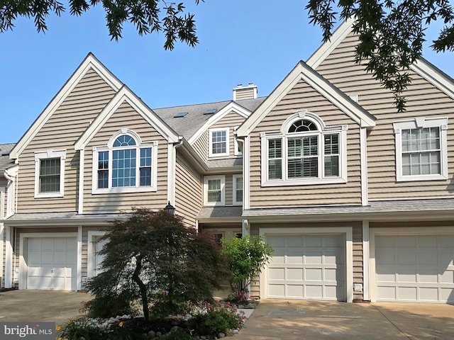 426 Fortress Way, Occoquan, VA 22125 - multi unit property with an attached garage, driveway, and a chimney