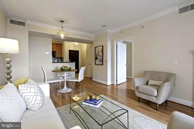 851 N Glebe Rd Unit 1103, Arlington, VA 22203 - living room featuring wood finished floors, baseboards, and crown molding