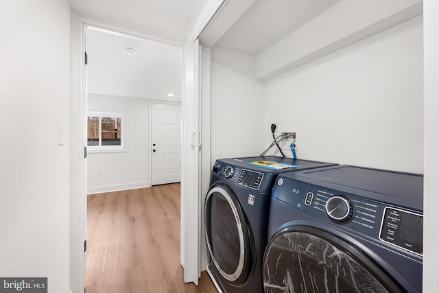 267 S Ellwood Ave, Baltimore, MD 21224 - laundry room featuring washing machine and clothes dryer, wood finished floors, and baseboards
