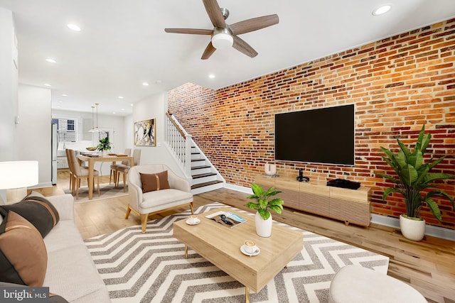 267 S Ellwood Ave, Baltimore, MD 21224 - living room featuring stairs, hardwood / wood-style floors, a ceiling fan, brick wall, and recessed lighting