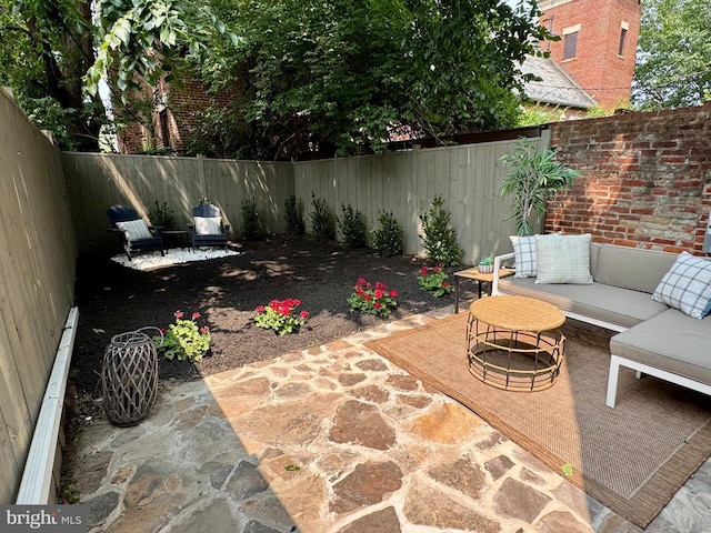 309 M St NW Unit Townhome B, Washington, DC 20001 - fenced backyard with an outdoor living space, a patio, and a baseboard heating unit