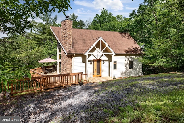 218 Nelson Way, Basye, VA 22810 - view of front facade with a chimney, roof with shingles, and a deck