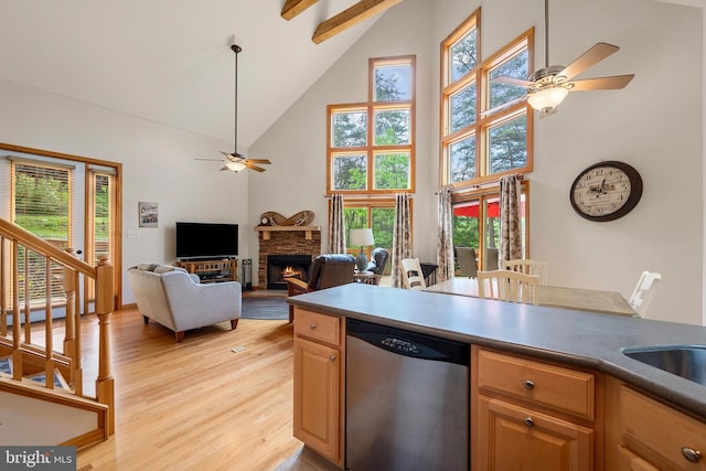 218 Nelson Way, Basye, VA 22810 - kitchen featuring stainless steel dishwasher, high vaulted ceiling, a ceiling fan, light wood-style flooring, and a stone fireplace