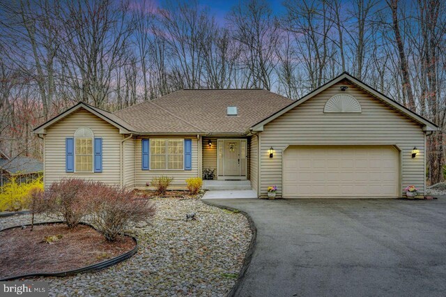3115 Sparrow Ct, East Stroudsburg, PA 18302 - view of front of property featuring driveway, a garage, and roof with shingles