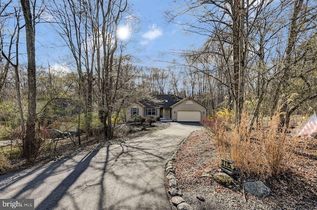 3115 Sparrow Ct, East Stroudsburg, PA 18302 - view of front of home with asphalt driveway and an attached garage