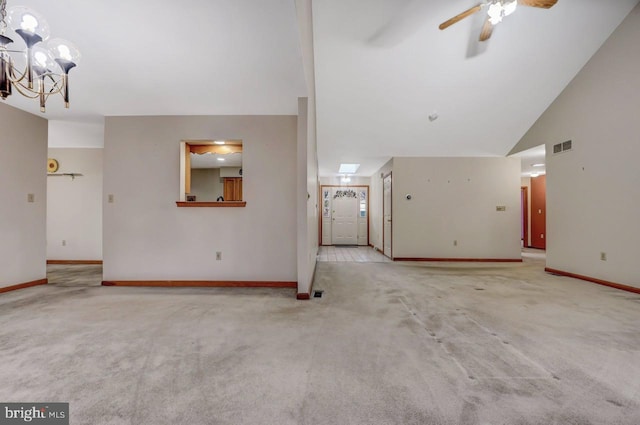 3115 Sparrow Ct, East Stroudsburg, PA 18302 - unfurnished living room with carpet flooring, a chandelier, baseboards, ceiling fan, and lofted ceiling