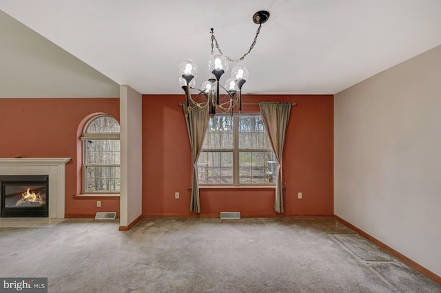 3115 Sparrow Ct, East Stroudsburg, PA 18302 - unfurnished dining area featuring a chandelier, carpet floors, baseboards, and a fireplace