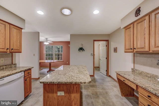 3115 Sparrow Ct, East Stroudsburg, PA 18302 - kitchen featuring dishwasher, a center island, ceiling fan, light stone countertops, and baseboards