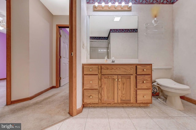 3115 Sparrow Ct, East Stroudsburg, PA 18302 - bathroom featuring vanity, baseboards, toilet, and tile patterned floors