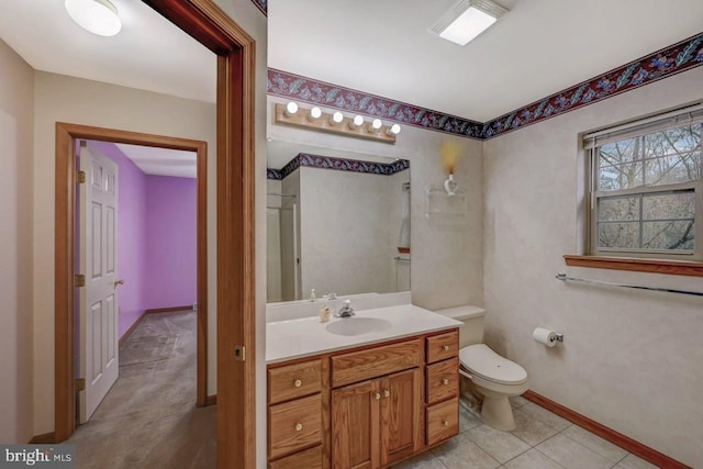 3115 Sparrow Ct, East Stroudsburg, PA 18302 - bathroom with vanity, toilet, baseboards, and tile patterned flooring