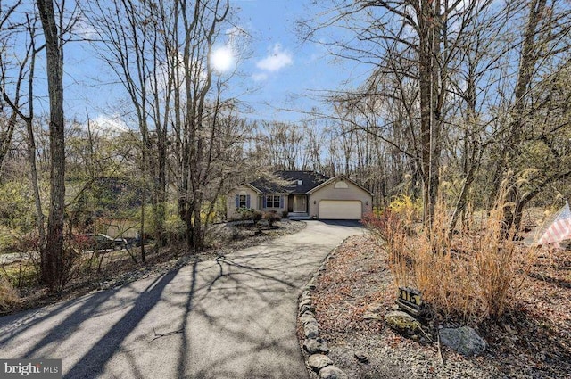 3115 Sparrow Ct, East Stroudsburg, PA 18302 - view of front facade with asphalt driveway and an attached garage