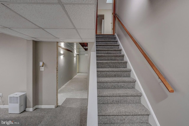 3115 Sparrow Ct, East Stroudsburg, PA 18302 - stairway featuring a drop ceiling, carpet floors, and baseboards