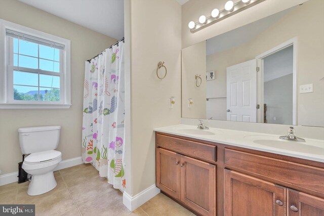 118 Connecticut Ave, Sinking Spring, PA 19608 - full bath with double vanity, toilet, baseboards, and tile patterned floors
