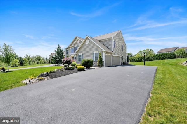 118 Connecticut Ave, Sinking Spring, PA 19608 - view of home's exterior with a garage, a yard, driveway, and stone siding