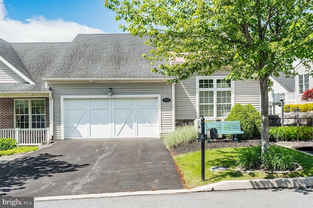 5529 Briar Ln, Whitehall, PA 18052 - view of front of home featuring a garage, driveway, and a shingled roof