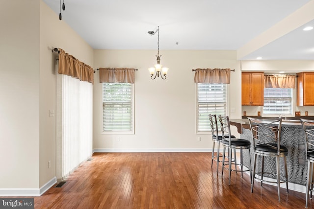 5529 Briar Ln, Whitehall, PA 18052 - kitchen featuring a breakfast bar area, wood-type flooring, a chandelier, baseboards, and recessed lighting