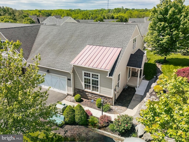 5529 Briar Ln, Whitehall, PA 18052 - view of front of house with stone siding, a garage, a standing seam roof, and roof with shingles