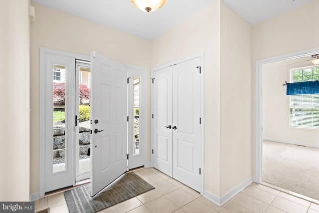 5529 Briar Ln, Whitehall, PA 18052 - entrance foyer featuring light tile patterned floors, baseboards, and light carpet