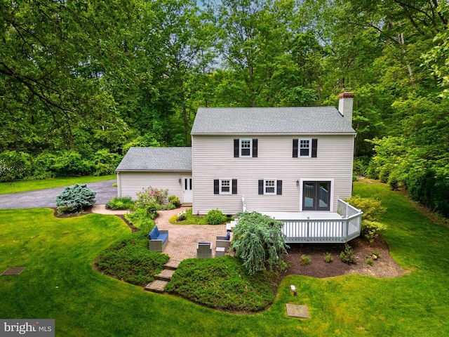 40 Grays Ln, Elverson, PA 19520 - rear view of property featuring a chimney, a yard, a deck, and a shingled roof