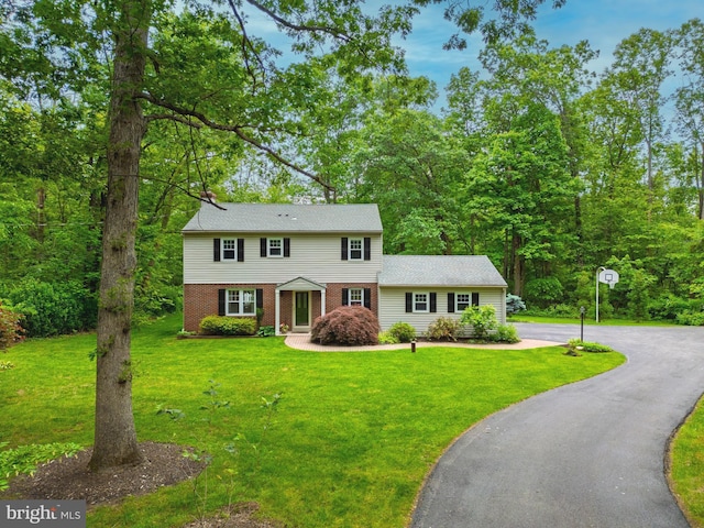40 Grays Ln, Elverson, PA 19520 - colonial inspired home with a front lawn, brick siding, and asphalt driveway