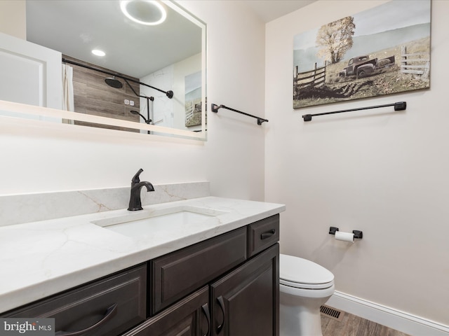 13610 Aden Rd, Nokesville, VA 20181 - full bath featuring vanity, toilet, wood finished floors, a shower with shower curtain, and baseboards