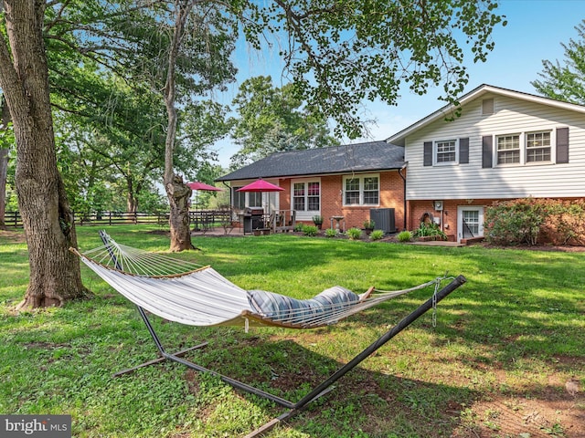 13610 Aden Rd, Nokesville, VA 20181 - rear view of house featuring brick siding and cooling unit