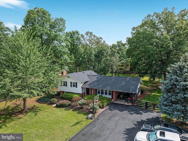 13610 Aden Rd, Nokesville, VA 20181 - split level home featuring asphalt driveway, a chimney, brick siding, a shingled roof, and an attached carport