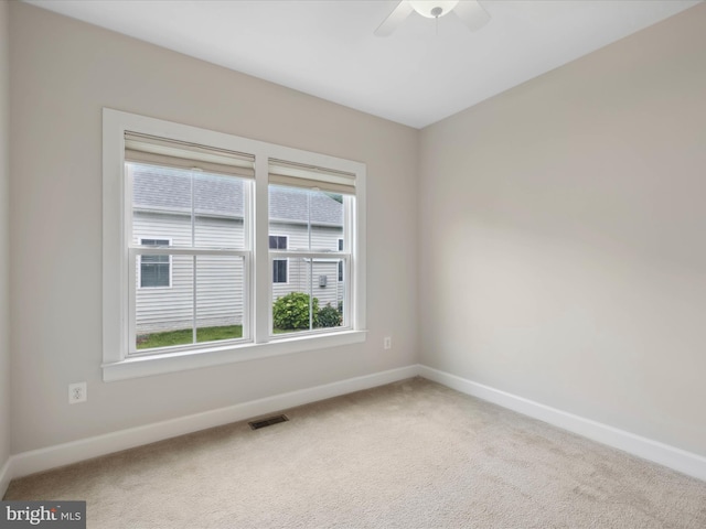 33512 Auburn Dr, Rehoboth Beach, DE 19971 - unfurnished room featuring baseboards, carpet flooring, ceiling fan, and plenty of natural light