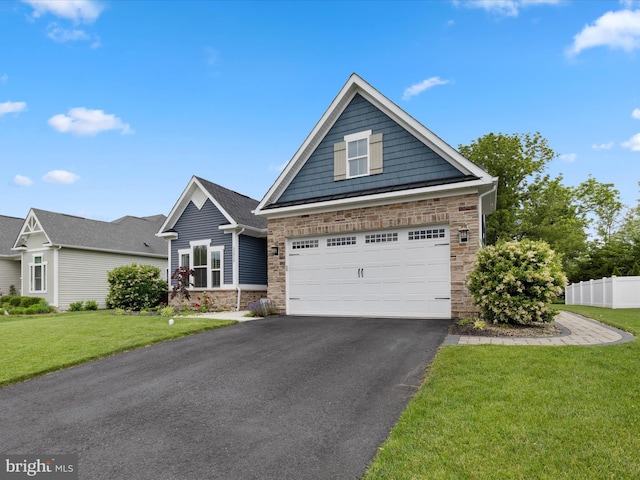 33512 Auburn Dr, Rehoboth Beach, DE 19971 - view of front of property featuring stone siding, a garage, and asphalt driveway