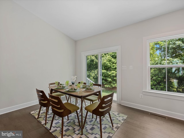 33512 Auburn Dr, Rehoboth Beach, DE 19971 - dining room featuring baseboards, healthy amount of natural light, and dark wood-type flooring