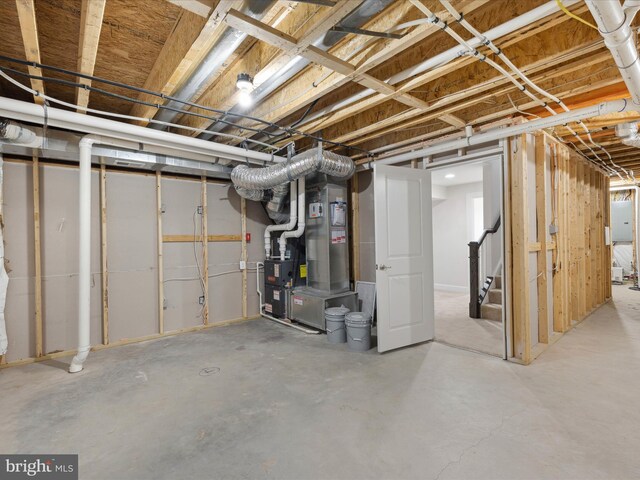 33512 Auburn Dr, Rehoboth Beach, DE 19971 - unfinished basement featuring stairway and heating unit