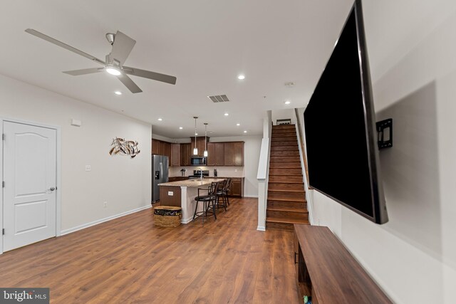 4524 Reaney Ln Unit 485, Owings Mills, MD 21117 - living area featuring baseboards, stairway, dark wood-style flooring, a ceiling fan, and recessed lighting