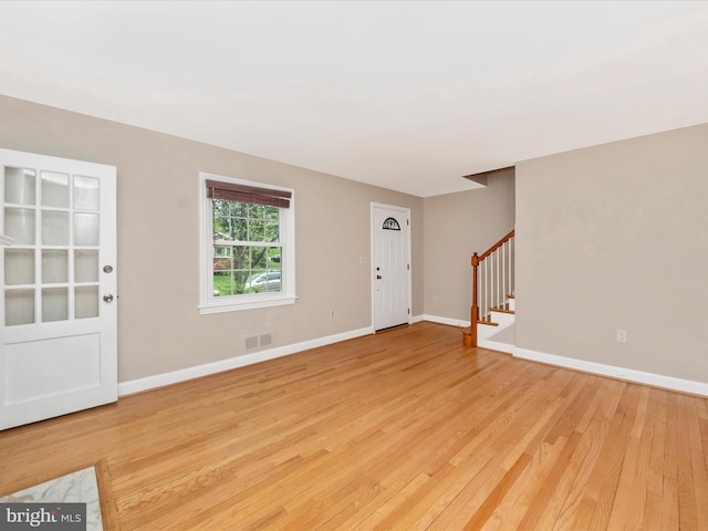 9905 Portland Rd, Silver Spring, MD 20901 - foyer featuring stairway, light wood-type flooring, and baseboards