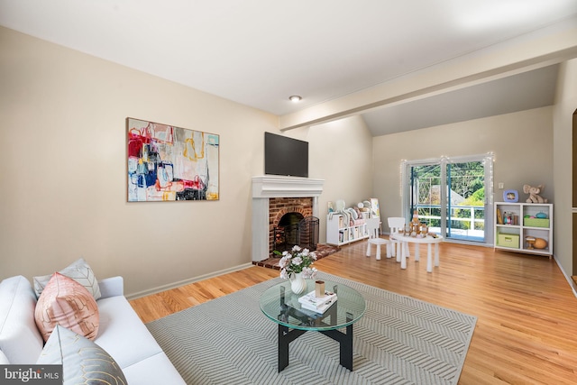 503 Emily Cir, West Chester, PA 19382 - living area featuring wood finished floors, a brick fireplace, beam ceiling, and baseboards