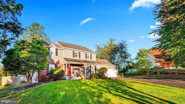 503 Emily Cir, West Chester, PA 19382 - traditional-style house featuring a garage, brick siding, and asphalt driveway
