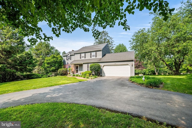 503 Emily Cir, West Chester, PA 19382 - view of front of house featuring driveway, an attached garage, a front lawn, and a chimney