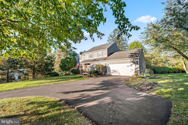 503 Emily Cir, West Chester, PA 19382 - traditional-style home with asphalt driveway, a garage, and a front lawn