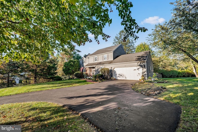 503 Emily Cir, West Chester, PA 19382 - traditional-style house with asphalt driveway, an attached garage, and a front yard
