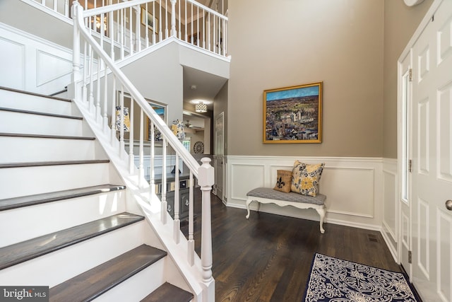 17 Brinker Dr Unit N, Doylestown, PA 18901 - foyer with wood finished floors, stairs, wainscoting, a decorative wall, and a towering ceiling