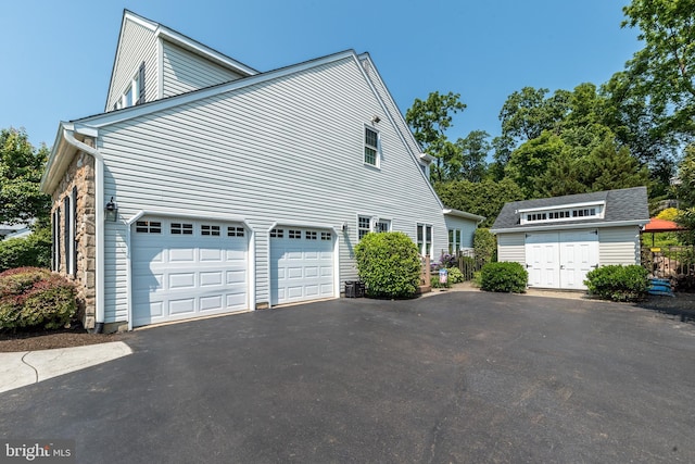 17 Brinker Dr Unit N, Doylestown, PA 18901 - view of side of property with driveway, a garage, and an outdoor structure